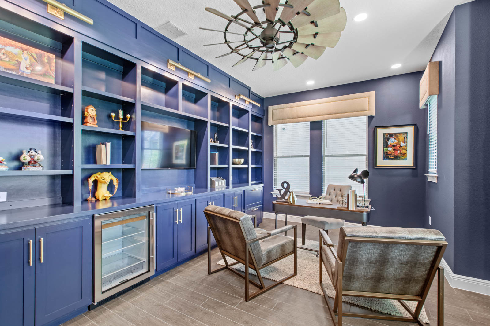 office with blue walls and built in shelving